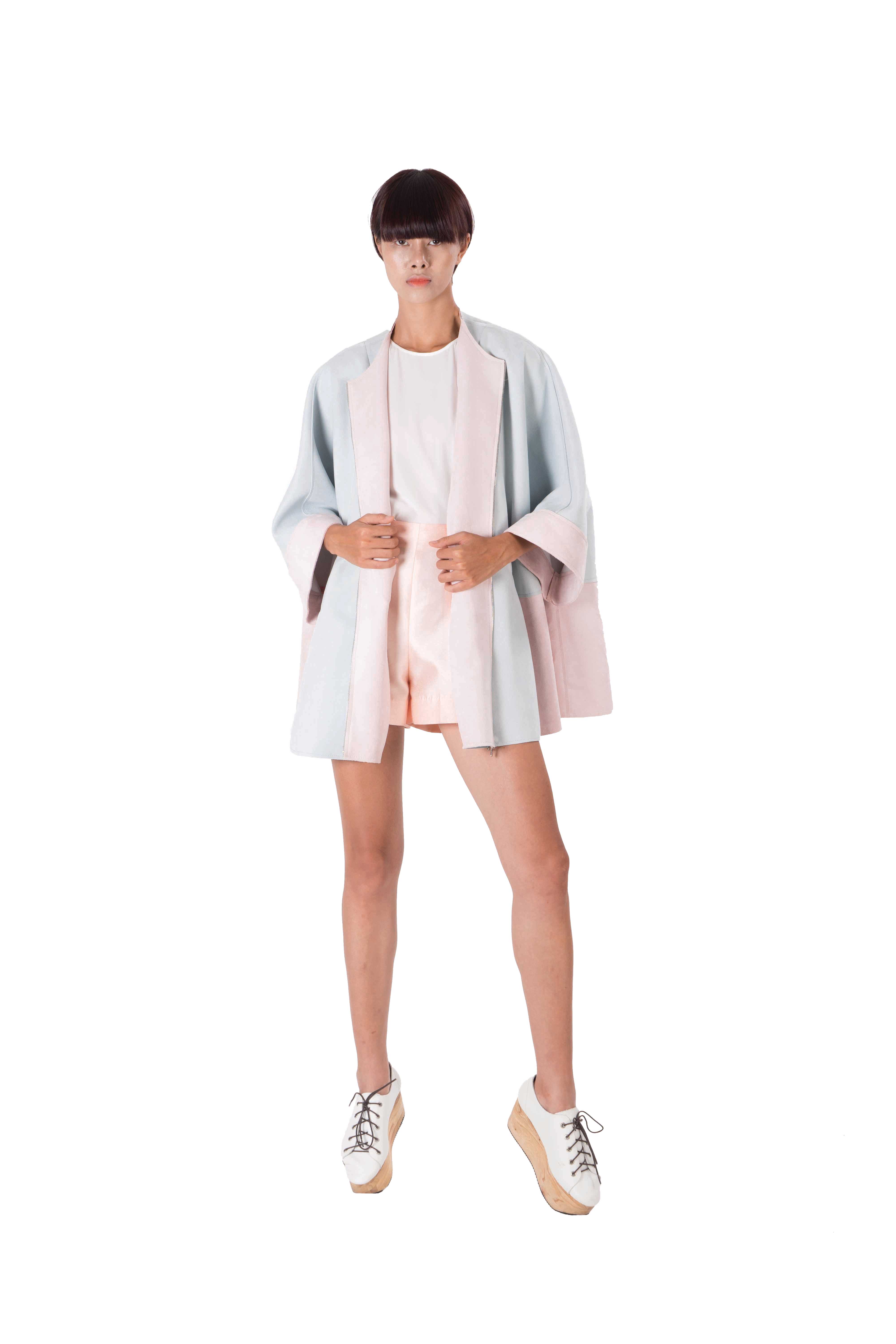 Contrasting blue and pink batwing jacket with laser cut detailing