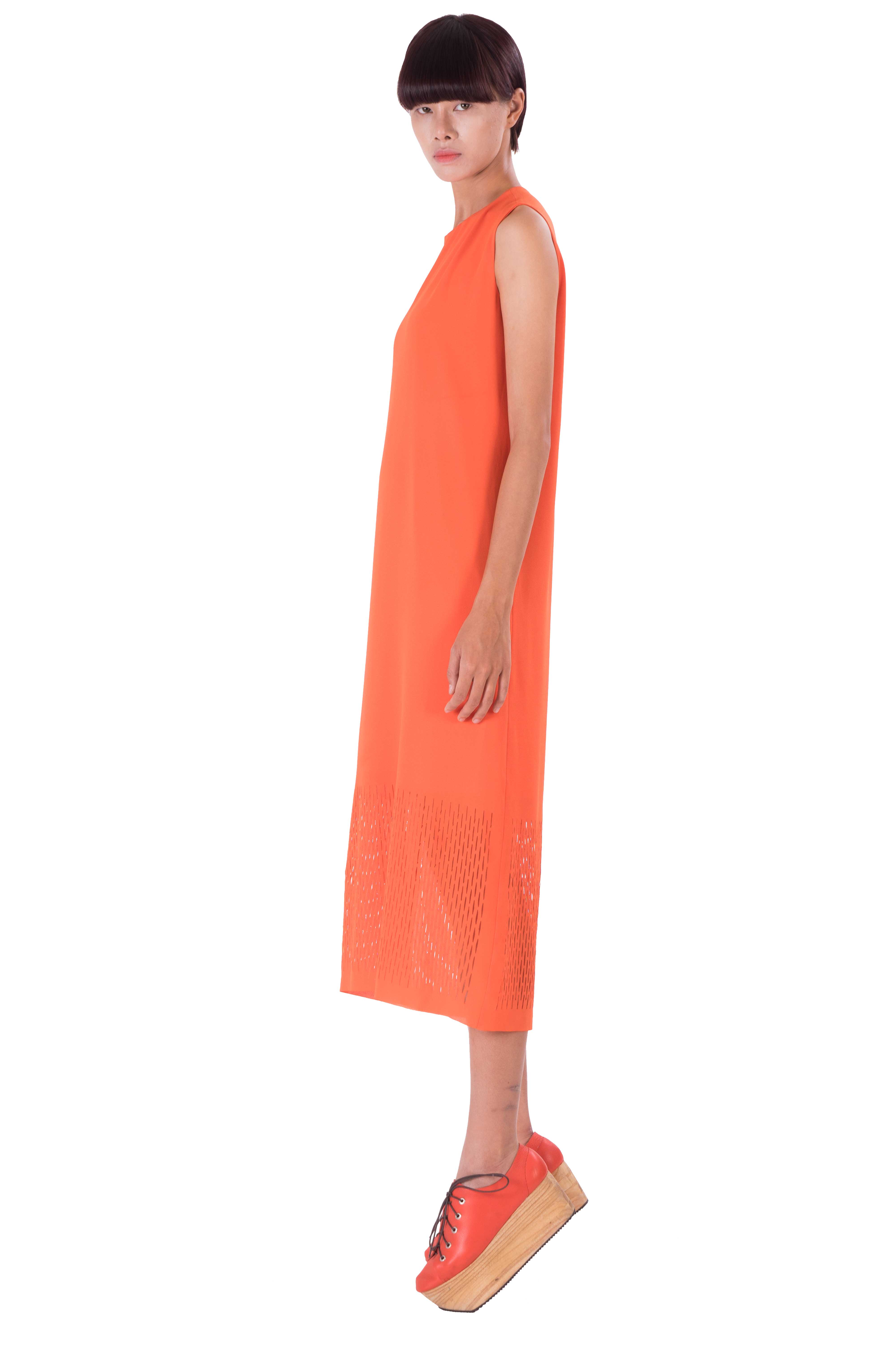 Orange sleeveless loose fit laser detailing dress with lining.