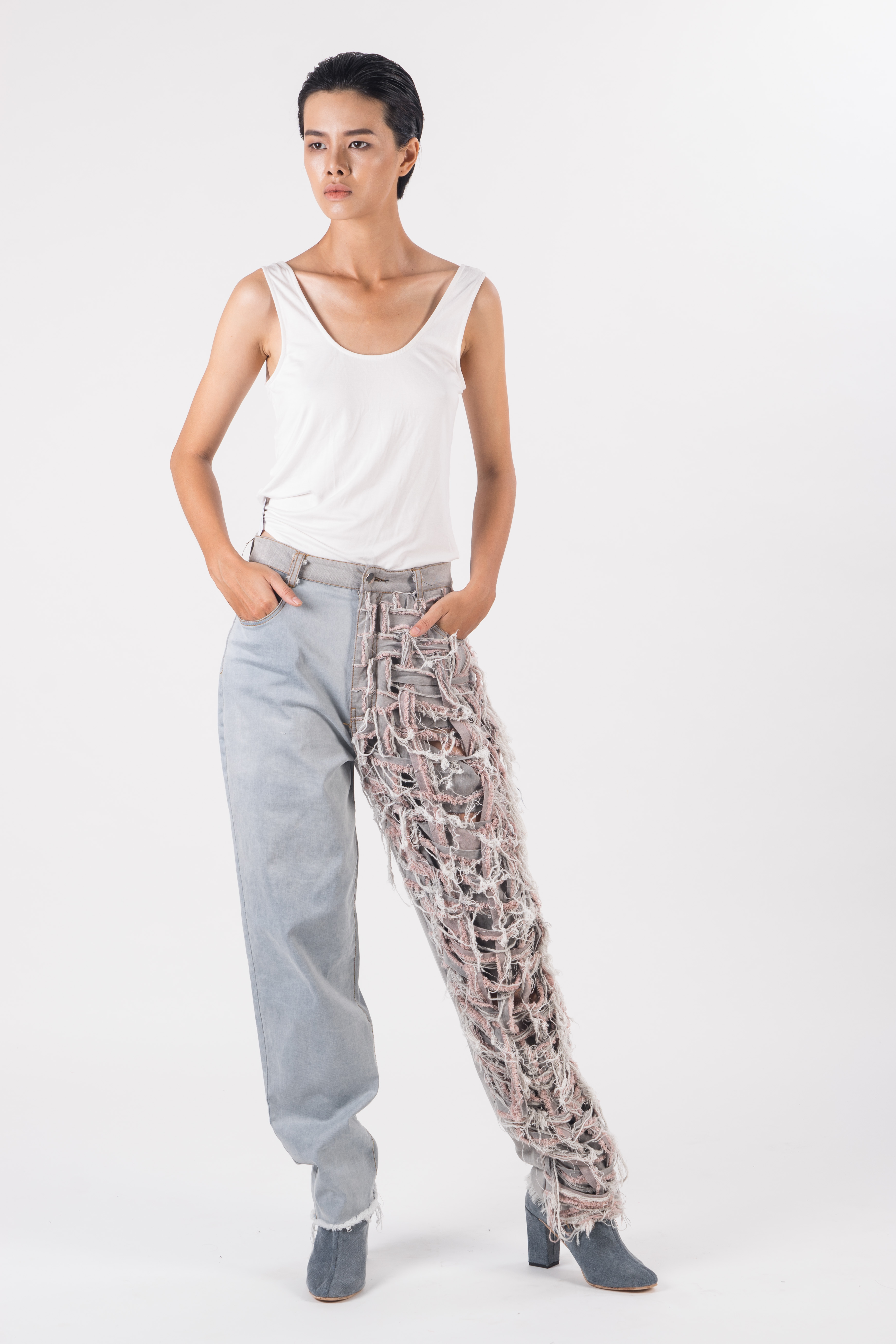 Grey distressed denim pants with front hand wovened and ripped effect front piece