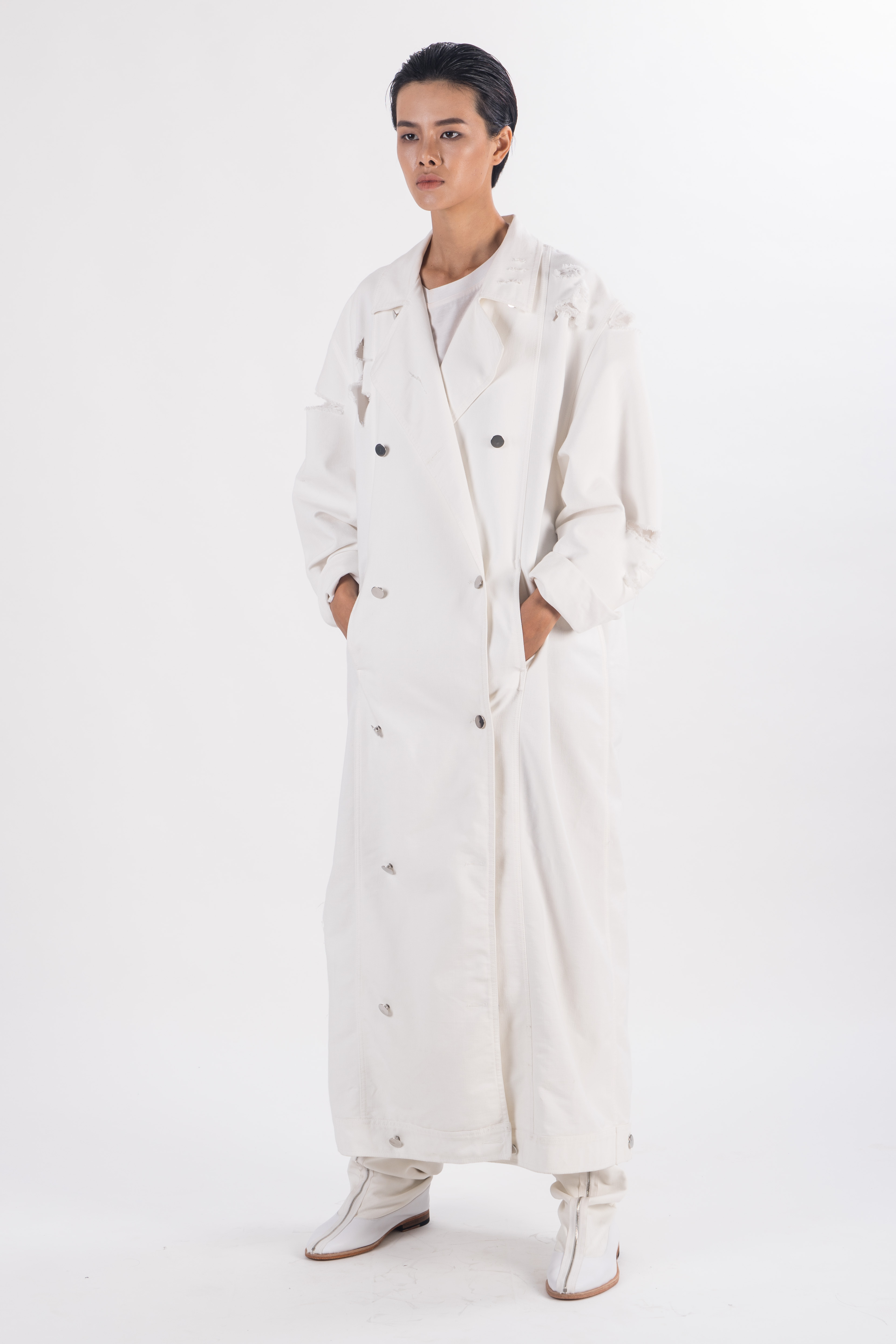 White  double breasted long heavy cotton coat with rips on shoulder and sleeves