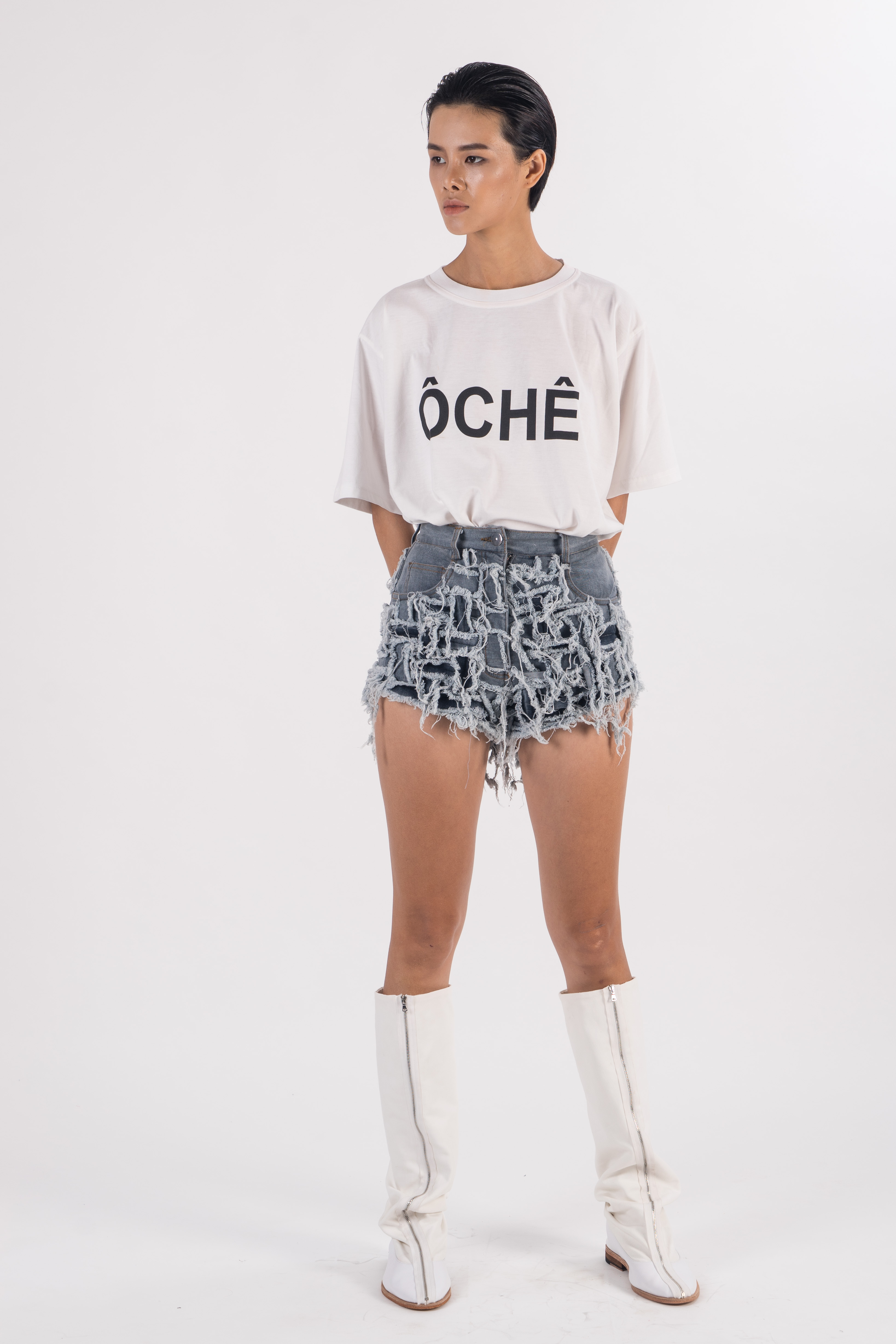 Light blue distressed denim shorts with front hand woven and frayed ...