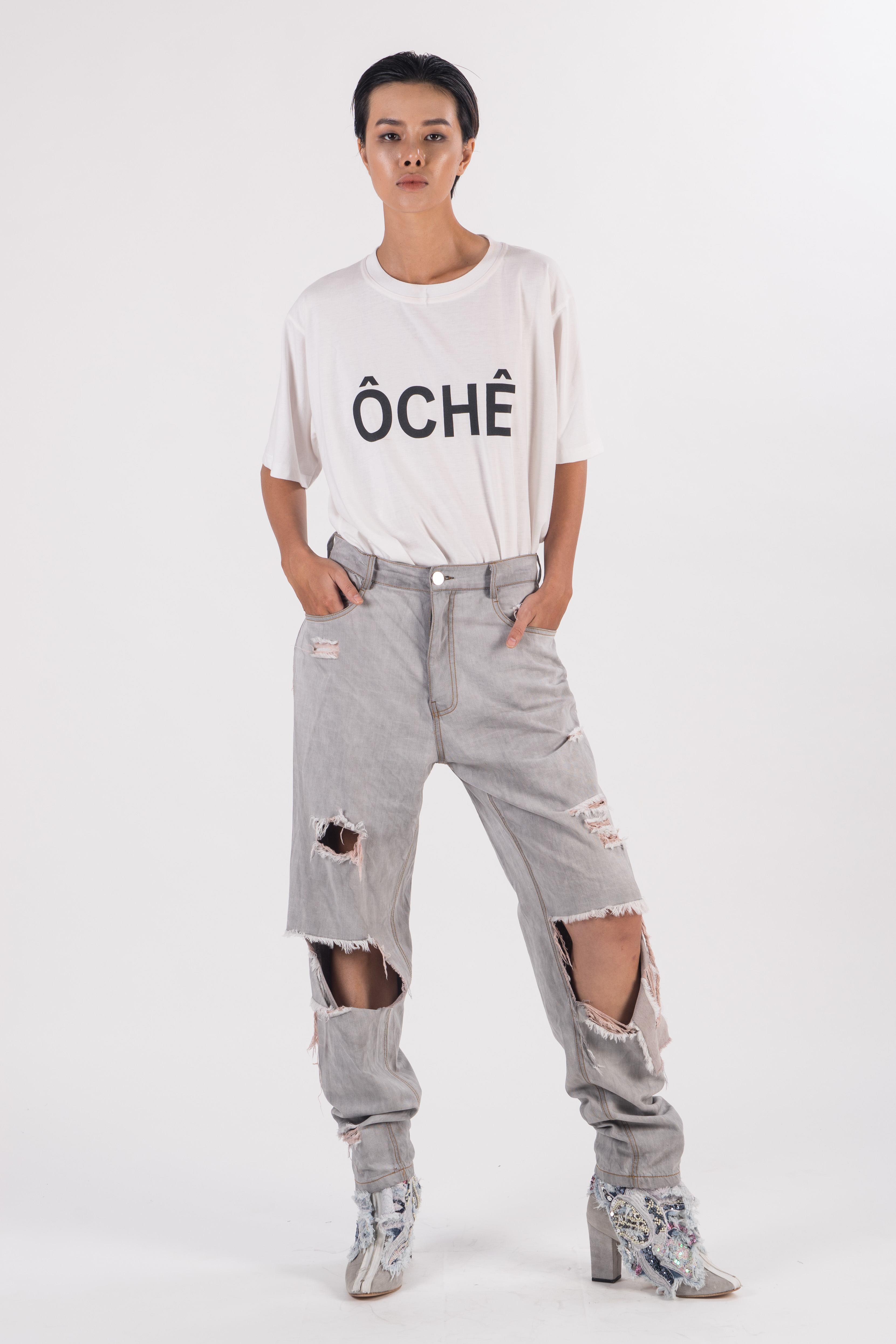 Light grey distress denim boyfriend pants with tears