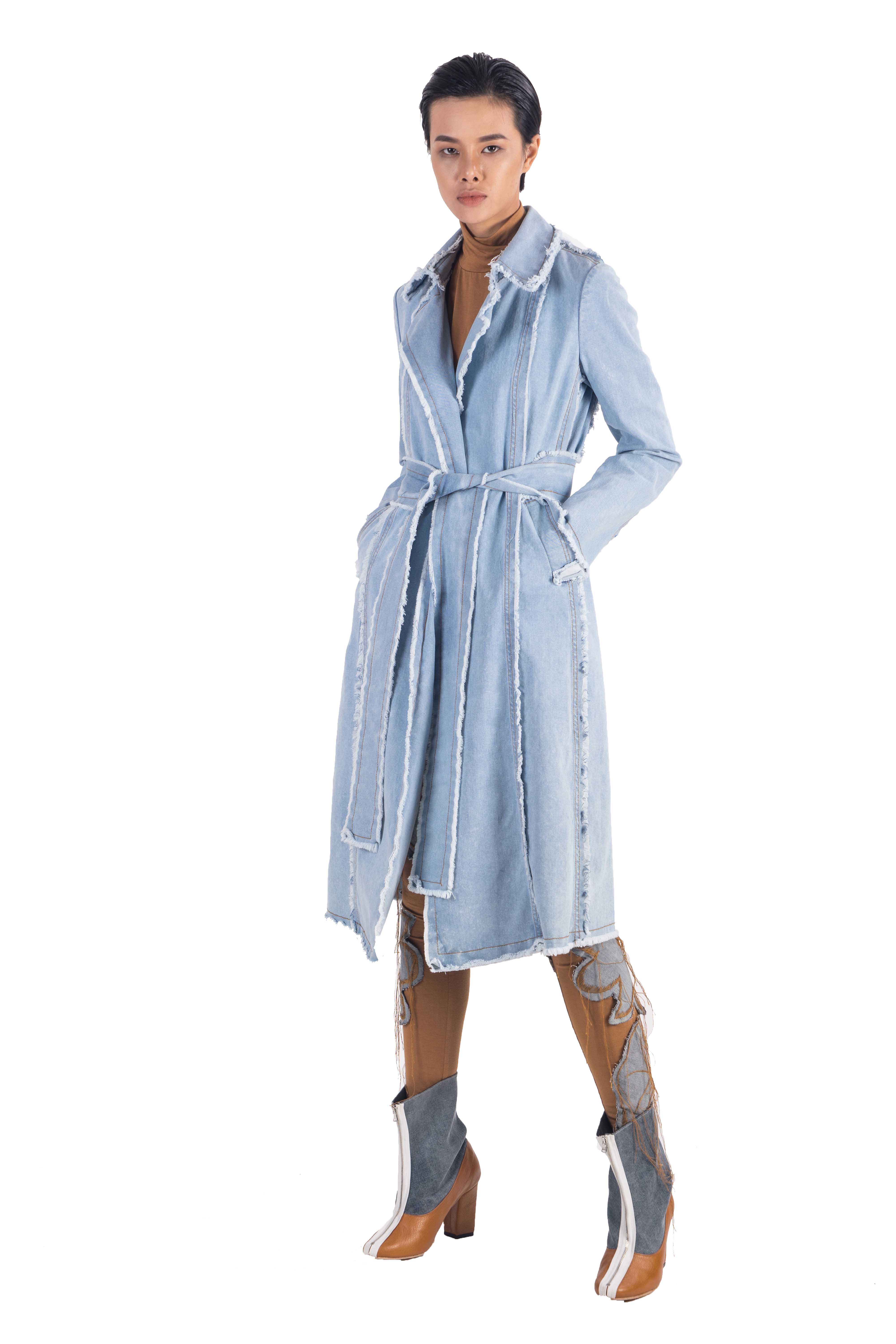 Sky blue washed denim trench coat with raw edges