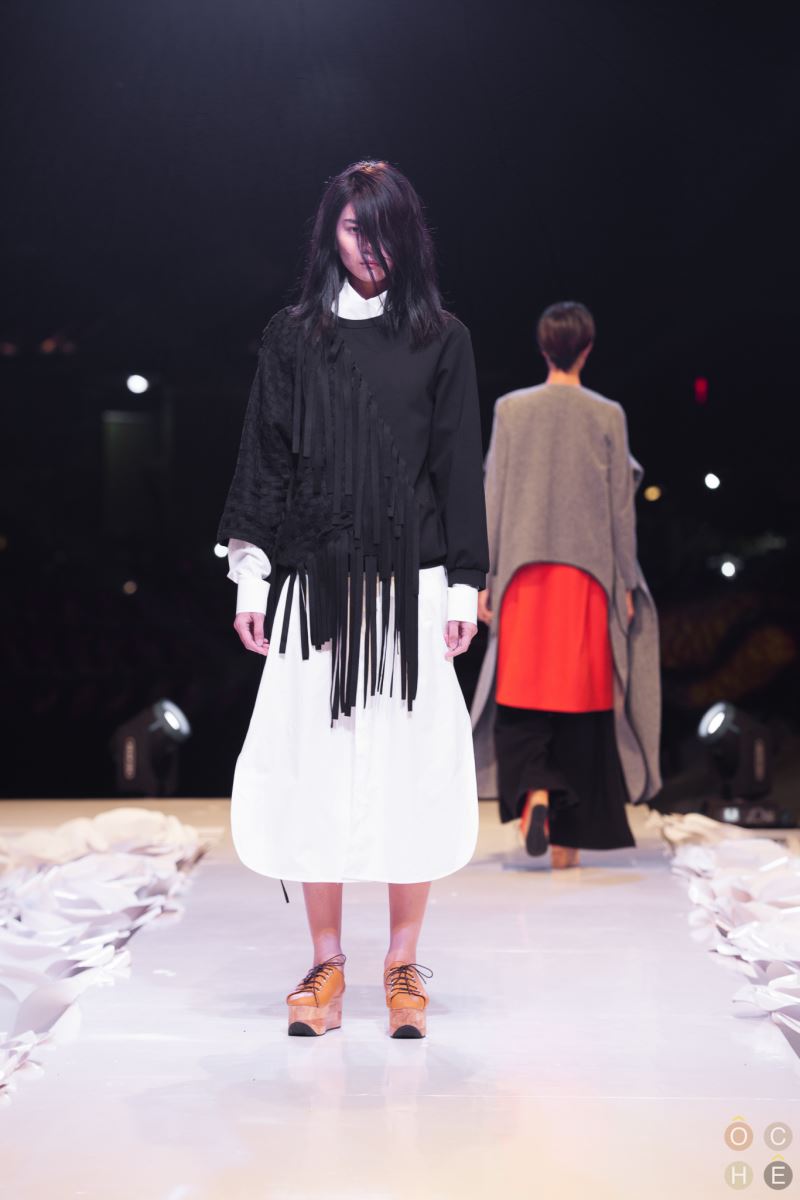 Black wool boxy loose fitting top with hand woven details