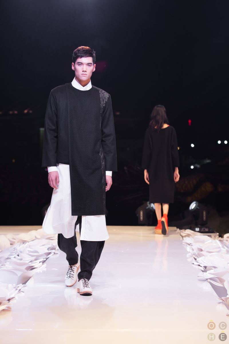 Black wool blend assymetrical jacket with laser cut out detailing