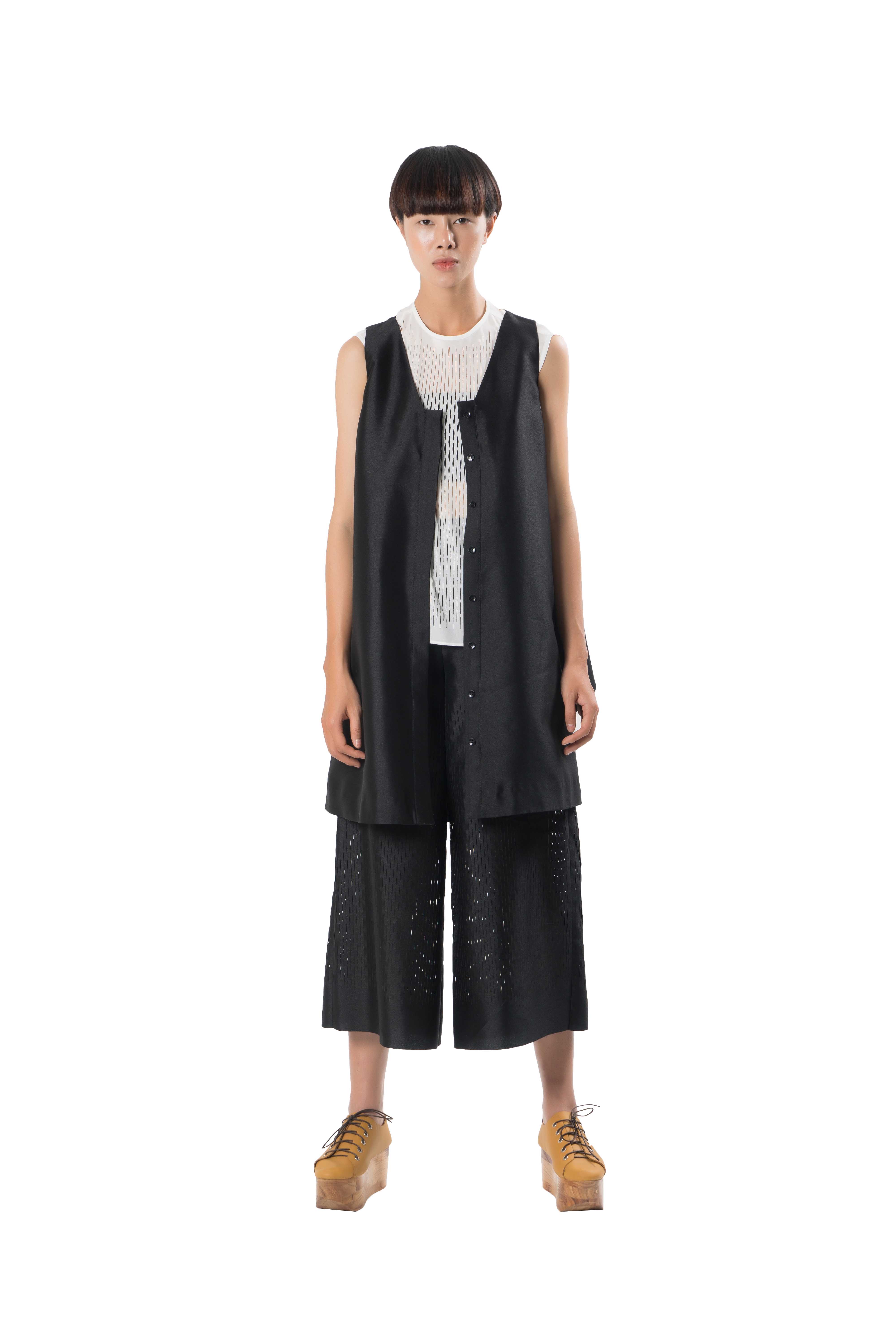 Black see through taffeta culottes with laser cut out detailing starting below hips